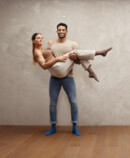 2. Juzo Intenso Strong man holding woman in his arms, both wearing Juzo Intenso