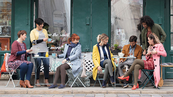 Juzo Soft Friends in a café. Some of them are wearing compression stockings.