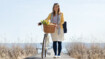 A woman on a bar wearing compression stockings.