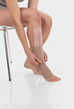 Juzo ScarPad, combinado com compressão na perna abaixo do joelho