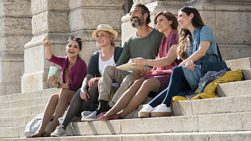 Friends are sitting on a staircase and wearing compression garments Friends are sitting on a staircase and wearing compression garments