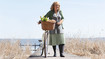 Woman on a walkway close to the beach.