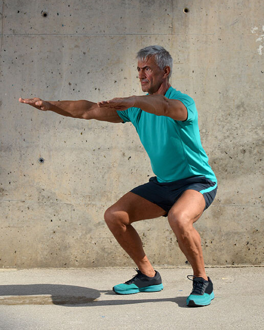 Man doing squats Man doing squats