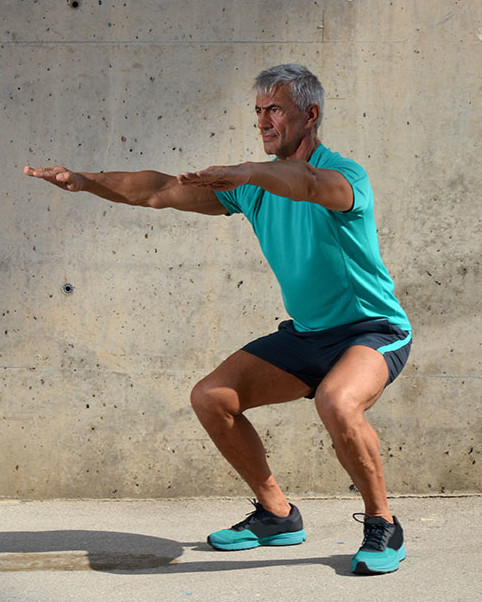 A man is doing squats A man is doing squats